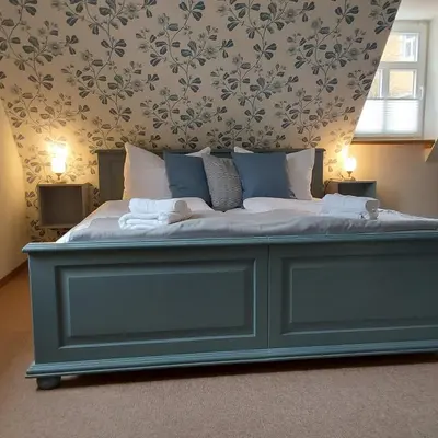 Ein Bett oder Betten in einem Zimmer der Unterkunft Bed and Breakfast Wehlen