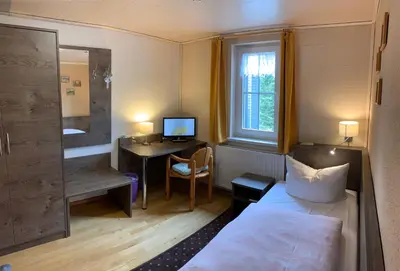 Ein Bett oder Betten in einem Zimmer der Unterkunft Hotel Dachsbaude & Kammbaude