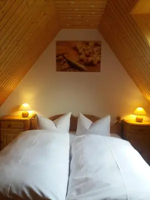 Ein Bett oder Betten in einem Zimmer der Unterkunft Windmühlenhof