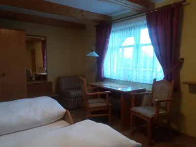 Ein Bett oder Betten in einem Zimmer der Unterkunft Windmühlenhof