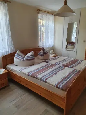 Ein Bett oder Betten in einem Zimmer der Unterkunft Ferienwohnung in der Sächsischen Schweiz