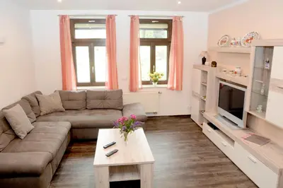 Ein Sitzbereich in der Unterkunft Ferienwohnung Villa AusZeit