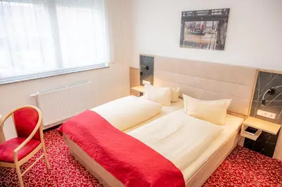 Ein Bett oder Betten in einem Zimmer der Unterkunft AaRa Hotel