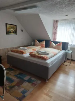 Ein Bett oder Betten in einem Zimmer der Unterkunft Pension Reichel