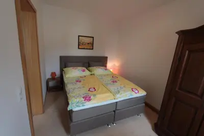 Ein Bett oder Betten in einem Zimmer der Unterkunft Ferienwohnung Frenkel