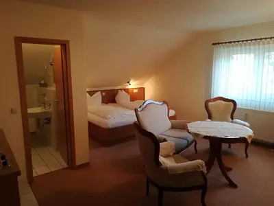 Ein Bett oder Betten in einem Zimmer der Unterkunft Weinbau & Pension 