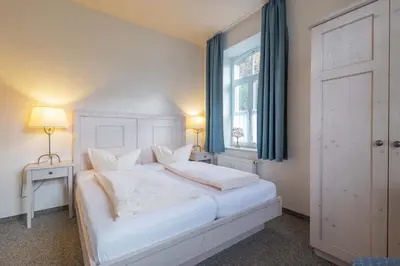 Ein Bett oder Betten in einem Zimmer der Unterkunft Ferienwohnung zur Steinburg