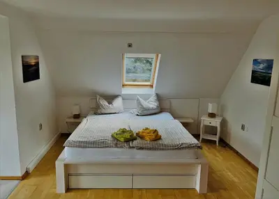 Ein Bett oder Betten in einem Zimmer der Unterkunft Waldhufenhaus in Schöna