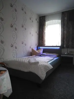 Ein Bett oder Betten in einem Zimmer der Unterkunft Landpension Haupt