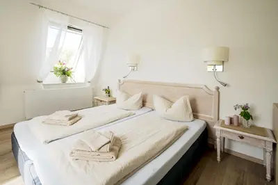 Ein Bett oder Betten in einem Zimmer der Unterkunft Apartments am Schlosspark