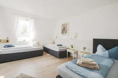 Ein Bett oder Betten in einem Zimmer der Unterkunft Apartments am Schlosspark
