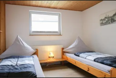 Ein Bett oder Betten in einem Zimmer der Unterkunft Ferienhaus Stiller Fritz