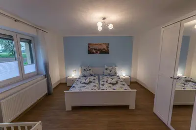 Ein Bett oder Betten in einem Zimmer der Unterkunft Ferienwohnung 