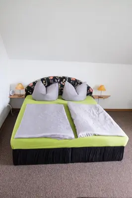 Ein Bett oder Betten in einem Zimmer der Unterkunft Am Zirkelstein 38 b