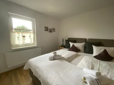 Ein Bett oder Betten in einem Zimmer der Unterkunft Panoramahotel Lilienstein