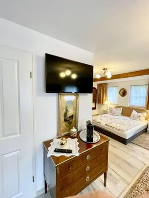 Ein Bett oder Betten in einem Zimmer der Unterkunft Ferienheim Kuckuckswinkel - Familiensuite