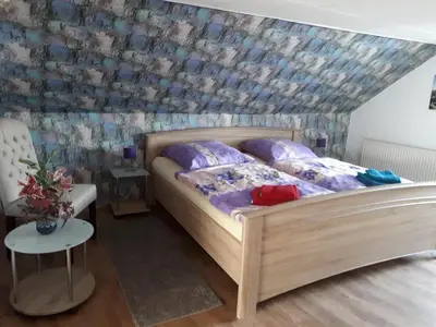 Ein Bett oder Betten in einem Zimmer der Unterkunft Ferienhaus Luise