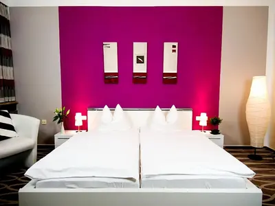 Ein Bett oder Betten in einem Zimmer der Unterkunft Hotel Albrechtshof Gohrisch
