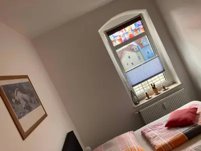 Ein Bett oder Betten in einem Zimmer der Unterkunft Ferienwohnung Kurzmalweg -Balkon-