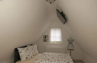 Ein Bett oder Betten in einem Zimmer der Unterkunft Ferienheim Kuckuckswinkel - Familiensuite Marlene
