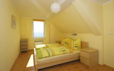 Ein Bett oder Betten in einem Zimmer der Unterkunft Panorama-Apartments Weinberghaus