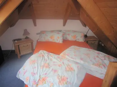 Ein Bett oder Betten in einem Zimmer der Unterkunft Studio Orchidee