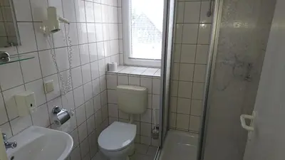 Ein Badezimmer in der Unterkunft Pension Erbgericht