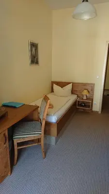 Ein Bett oder Betten in einem Zimmer der Unterkunft Kurparkstübl Bad Schandau