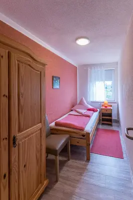 Ein Bett oder Betten in einem Zimmer der Unterkunft Landhaus Rundblick im Elbsandsteingebirge bei Bad Schandau