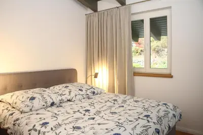 Ein Bett oder Betten in einem Zimmer der Unterkunft Haus Menuett - Kamin - Terrasse