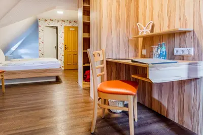 Ein Bett oder Betten in einem Zimmer der Unterkunft Hotel Folklorehof