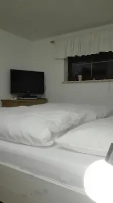 Ein Bett oder Betten in einem Zimmer der Unterkunft Gästezimmer Familie Müller