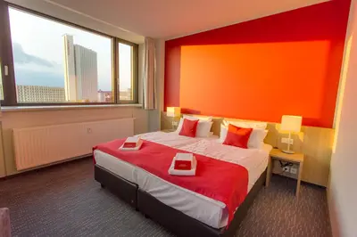Ein Bett oder Betten in einem Zimmer der Unterkunft Biendo Hotel