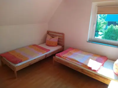 Ein Bett oder Betten in einem Zimmer der Unterkunft Ferienhaus Ebenheit am Lilienstein
