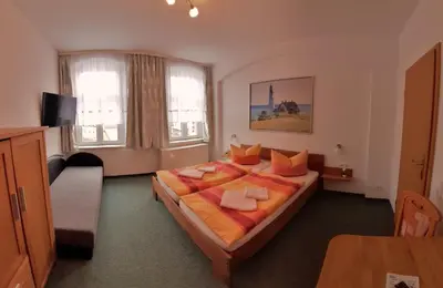 Ein Bett oder Betten in einem Zimmer der Unterkunft Gästehaus Heidi