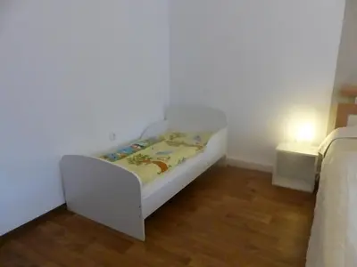 Ein Bett oder Betten in einem Zimmer der Unterkunft Ferienwohnung Zur Alten Eiche