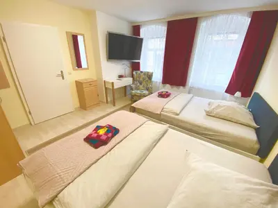 Ein Bett oder Betten in einem Zimmer der Unterkunft Ferienwohnungen Grimma 1