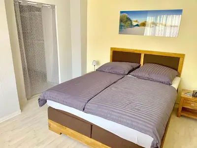 Ein Bett oder Betten in einem Zimmer der Unterkunft Ferienwohnungen Grimma 1
