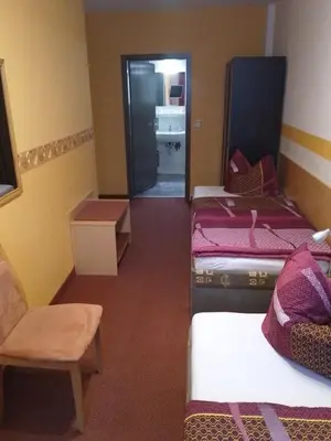 Ein Bett oder Betten in einem Zimmer der Unterkunft Pension Tiffany