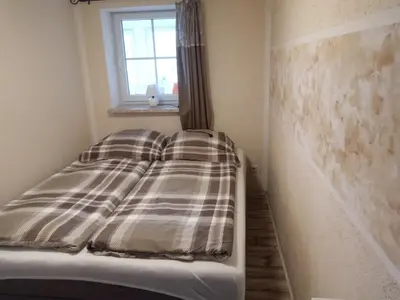 Ein Bett oder Betten in einem Zimmer der Unterkunft Festung Märcz