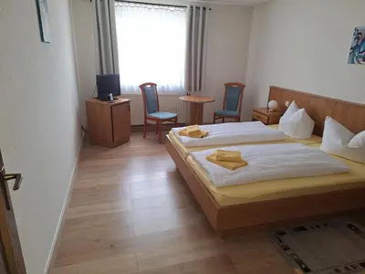 Ein Bett oder Betten in einem Zimmer der Unterkunft Hotel Heidler