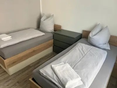 Ein Bett oder Betten in einem Zimmer der Unterkunft Gästehaus Graupner-Mittweida