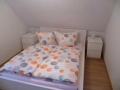 Ein Bett oder Betten in einem Zimmer der Unterkunft Ferienhaus zum Kirnitzschtal