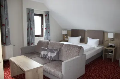 Ein Bett oder Betten in einem Zimmer der Unterkunft Parkhotel Margaretenhof