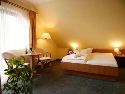 Ein Bett oder Betten in einem Zimmer der Unterkunft Hotel Waldesruh