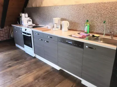 Küche/Küchenzeile in der Unterkunft Gemütliche Ferienwohnung TURMZIMMER im Rittergut Leppersdorf bei Dresden