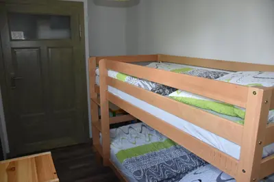 Ein Etagenbett oder Etagenbetten in einem Zimmer der Unterkunft Bahnhof Laussnitz