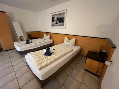 Ein Bett oder Betten in einem Zimmer der Unterkunft Apartmenthaus Home24
