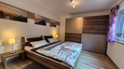 Ein Bett oder Betten in einem Zimmer der Unterkunft Ferienwohnung Am Rauenstein