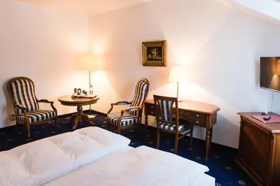 Ein Bett oder Betten in einem Zimmer der Unterkunft Historische Spitzgrundmühle